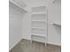 Organized walk-in closet featuring built-in shelving units and ample storage space at 4883 W 68Th Ave # 3, Westminster, CO 80030