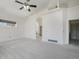 Large, bright bedroom with high ceilings, an archway, and new carpet at 1535 Longview Cir, Monument, CO 80132