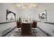 Elegant dining room featuring a decorative chandelier and stylish decor at 1535 Longview Cir, Monument, CO 80132