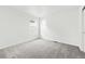 Bright bedroom featuring neutral carpet and large windows at 16618 W 92Nd Pl, Arvada, CO 80007