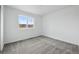 Bedroom with neutral carpet and a view of the neighborhood at 16618 W 92Nd Pl, Arvada, CO 80007