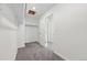 An organized walk-in closet with carpet floors and plenty of shelf space at 16618 W 92Nd Pl, Arvada, CO 80007