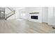Spacious living room featuring a fireplace, hardwood floors, and lots of natural light at 16618 W 92Nd Pl, Arvada, CO 80007