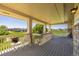 Back porch with lovely views of a golf course, landscaping, and residences in the distance at 27565 E Nova Pl, Aurora, CO 80016