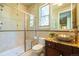 Beautiful bathroom with a glass-enclosed shower, stylish vessel sink, and elegant granite countertops at 27565 E Nova Pl, Aurora, CO 80016