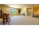 Spacious bonus room with large windows and neutral carpet is perfect for entertaining or relaxing at 27565 E Nova Pl, Aurora, CO 80016