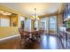 Dining room with hardwood floors and ample natural light, with view to living and kitchen at 27565 E Nova Pl, Aurora, CO 80016