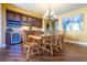 Dining room featuring custom cabinetry and a wine fridge, perfect for entertaining at 27565 E Nova Pl, Aurora, CO 80016