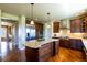 Gourmet kitchen with large island and stainless steel appliances and built in oven at 27565 E Nova Pl, Aurora, CO 80016