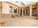 Inviting outdoor patio with stone details, comfortable seating, and easy access to indoor spaces at 27565 E Nova Pl, Aurora, CO 80016