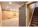 Finished basement with carpeted stairs leading down at 9025 W 79Th Way # D, Arvada, CO 80005