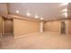 Neutral finished basement with recessed lighting, neutral walls and carpet at 9025 W 79Th Way # D, Arvada, CO 80005