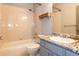 Bathroom featuring a shower over tub and single sink with storage at 9025 W 79Th Way # D, Arvada, CO 80005