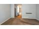 Bedroom with neutral walls, carpet, and an entrance to the bathroom at 9025 W 79Th Way # D, Arvada, CO 80005