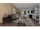 Cozy living room featuring a stylish sofa, fireplace, and neutral decor, perfect for relaxation at 9025 W 79Th Way # D, Arvada, CO 80005