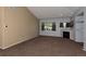 Large living room with vaulted ceiling, fireplace, and large windows, offering ample space at 9025 W 79Th Way # D, Arvada, CO 80005