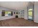 Bright living room with a cozy fireplace, built-in shelves, and abundant natural light at 9025 W 79Th Way # D, Arvada, CO 80005