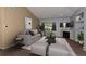 Inviting living room featuring vaulted ceilings, a cozy fireplace, and neutral decor at 9025 W 79Th Way # D, Arvada, CO 80005