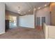 Spacious carpeted living area featuring a ceiling fan and sliding glass doors to the outside at 9025 W 79Th Way # D, Arvada, CO 80005