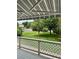 Inviting porch view featuring a well-maintained green lawn and mature trees, creating a serene outdoor space at 9025 W 79Th Way # D, Arvada, CO 80005