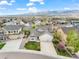 Aerial view of home showcases mature trees, lush lawn, and mountain views at 735 Chesapeake Ave, Monument, CO 80132
