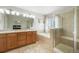 Bathroom boasts double sinks, shower, tub, tile floors and lighting at 735 Chesapeake Ave, Monument, CO 80132