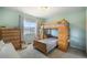 This bedroom includes a bunk bed, a dresser, and a large window at 735 Chesapeake Ave, Monument, CO 80132