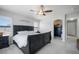 Bedroom featuring soft carpeting, natural light through plantation shutters, and a large walk-in closet at 735 Chesapeake Ave, Monument, CO 80132