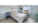 This bedroom has carpet, a bed, a nightstand, and a window with a great view at 735 Chesapeake Ave, Monument, CO 80132
