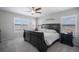 Bedroom with fan and large window provides a relaxing retreat with soft carpeting and neutral decor at 735 Chesapeake Ave, Monument, CO 80132