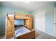 This bedroom features a bunk bed and a closet with sliding doors at 735 Chesapeake Ave, Monument, CO 80132