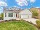 Charming home featuring a manicured lawn, two car garage, and a beautiful bay window for ample natural light at 735 Chesapeake Ave, Monument, CO 80132
