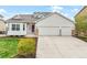 Charming home featuring a manicured lawn, two car garage, and a beautiful bay window for ample natural light at 735 Chesapeake Ave, Monument, CO 80132
