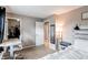Bedroom including a study area, closet, and neutral colored walls at 10109 W Fremont Ave, Littleton, CO 80127