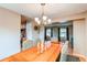 Dining room featuring a wooden table, comfortable chairs, and stylish chandelier at 10109 W Fremont Ave, Littleton, CO 80127