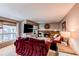 Cozy living room with a fireplace, comfortable seating, and a large television at 10109 W Fremont Ave, Littleton, CO 80127