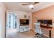 Home office with modern desk, neutral walls, and ample natural light at 10109 W Fremont Ave, Littleton, CO 80127