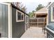 Yard with a storage shed, a barbecue grill, and a wood fence at 10109 W Fremont Ave, Littleton, CO 80127