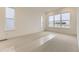 Bright bedroom featuring large windows, neutral carpet, and plenty of natural light at 231 Leafy Aster Ln, Castle Rock, CO 80104
