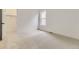 Bright bedroom featuring a closet, neutral carpet, and a large window at 231 Leafy Aster Ln, Castle Rock, CO 80104