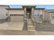 Beautiful two-story home featuring a stone facade, attached garage, and a well-manicured front yard at 231 Leafy Aster Ln, Castle Rock, CO 80104