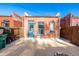 Cozy backyard featuring a firepit, brick building, and a fence at 561 Cherokee St, Denver, CO 80204