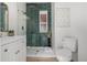 Nicely remodeled bathroom with a tiled shower, modern toilet, and vanity at 561 Cherokee St, Denver, CO 80204