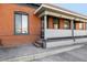 Charming front porch with classic brick exterior, providing a welcoming entrance at 561 Cherokee St, Denver, CO 80204