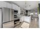 Contemporary kitchen with stainless steel appliances, white cabinetry, and an open floor plan at 561 Cherokee St, Denver, CO 80204