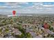 Community aerial view shows Aurora Reservoir, homes, and neighborhood amenities on a sunny day at 6520 S Newcastle Way, Aurora, CO 80016