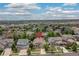 Aerial view of a neighborhood with tree-lined streets and well-maintained homes on a sunny day at 6520 S Newcastle Way, Aurora, CO 80016