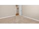 Neutral bedroom featuring carpet, light walls, and an entry doorway at 6520 S Newcastle Way, Aurora, CO 80016