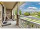 Charming front porch with stone pillars, ideal for relaxing and enjoying the neighborhood views at 6520 S Newcastle Way, Aurora, CO 80016