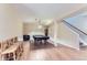 Spacious basement featuring a pool table, bar stools, staircase, and neutral walls at 2716 Dundee Pl, Erie, CO 80516